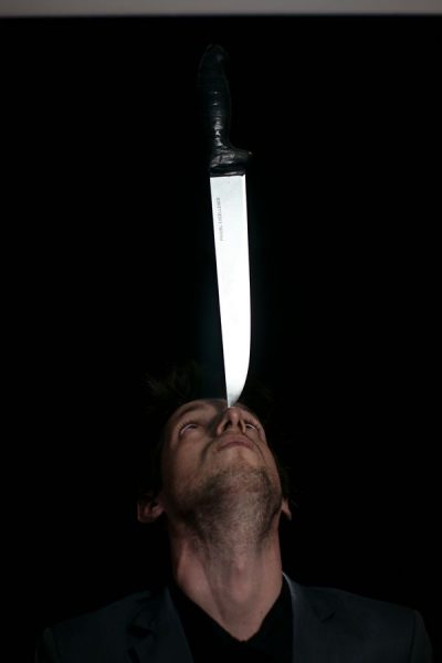 Knife balancing on the nose