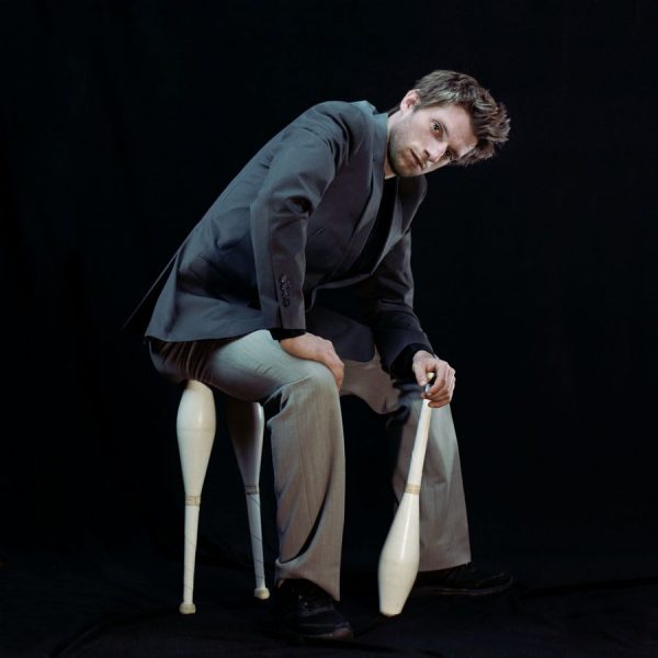 Max sits on his clubs